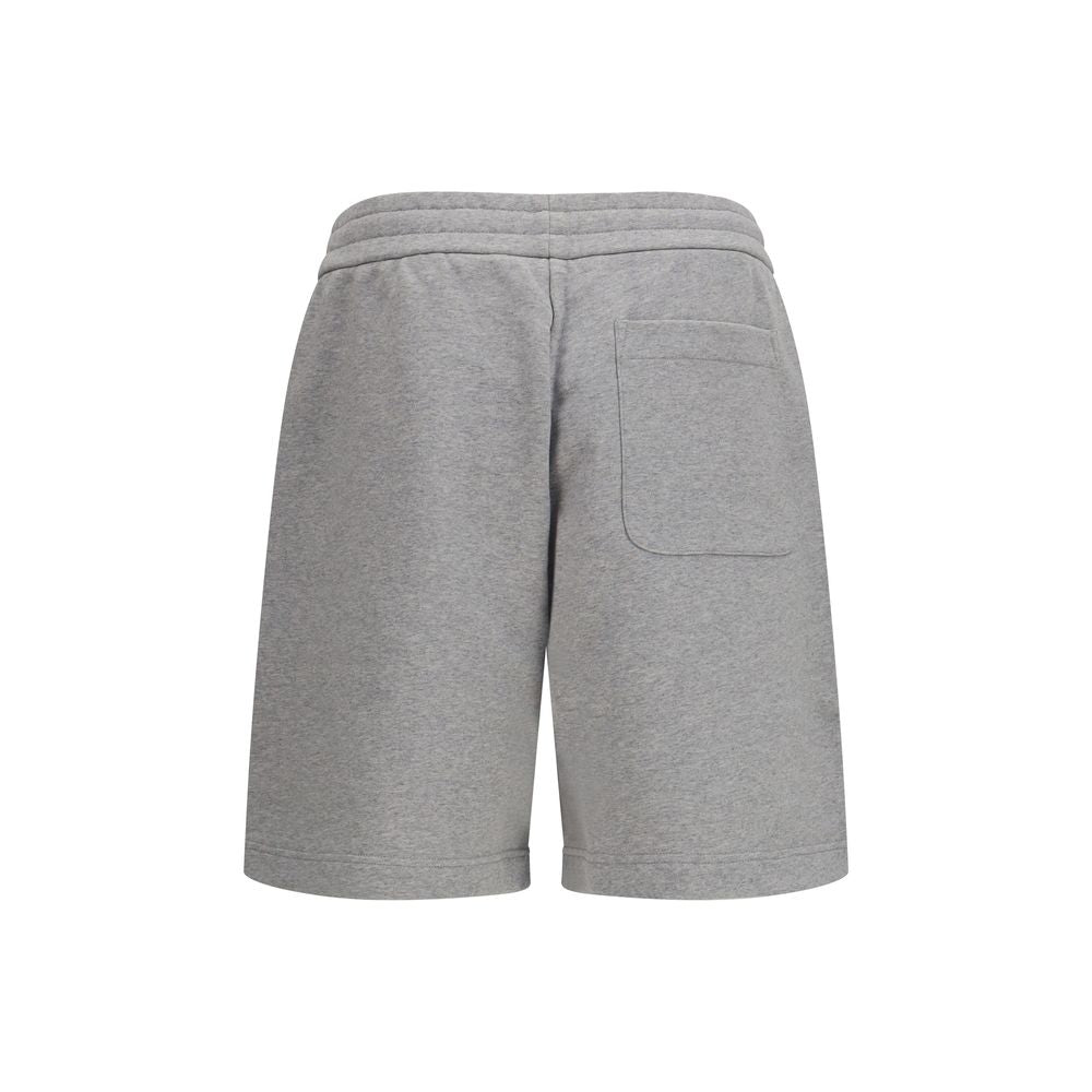 Shorts Bermuda gris en coton de la marque Moncler, avec coupe décontractée et détails modernes visibles sur l'image.