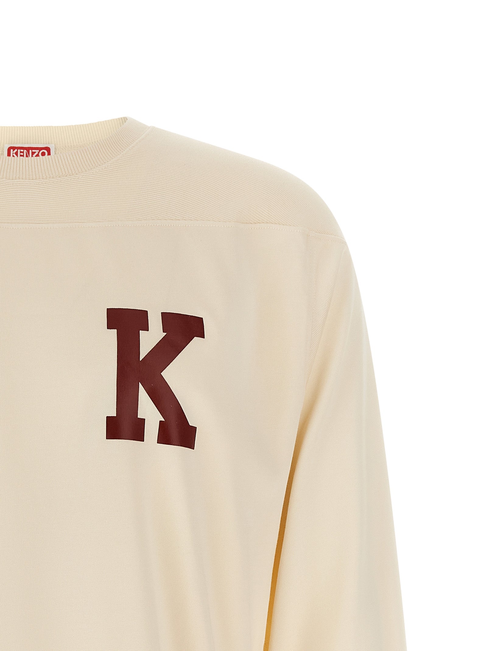 T-shirt beige en viscose de la marque Kenzo, vue de face, avec logo discret sur la poitrine.