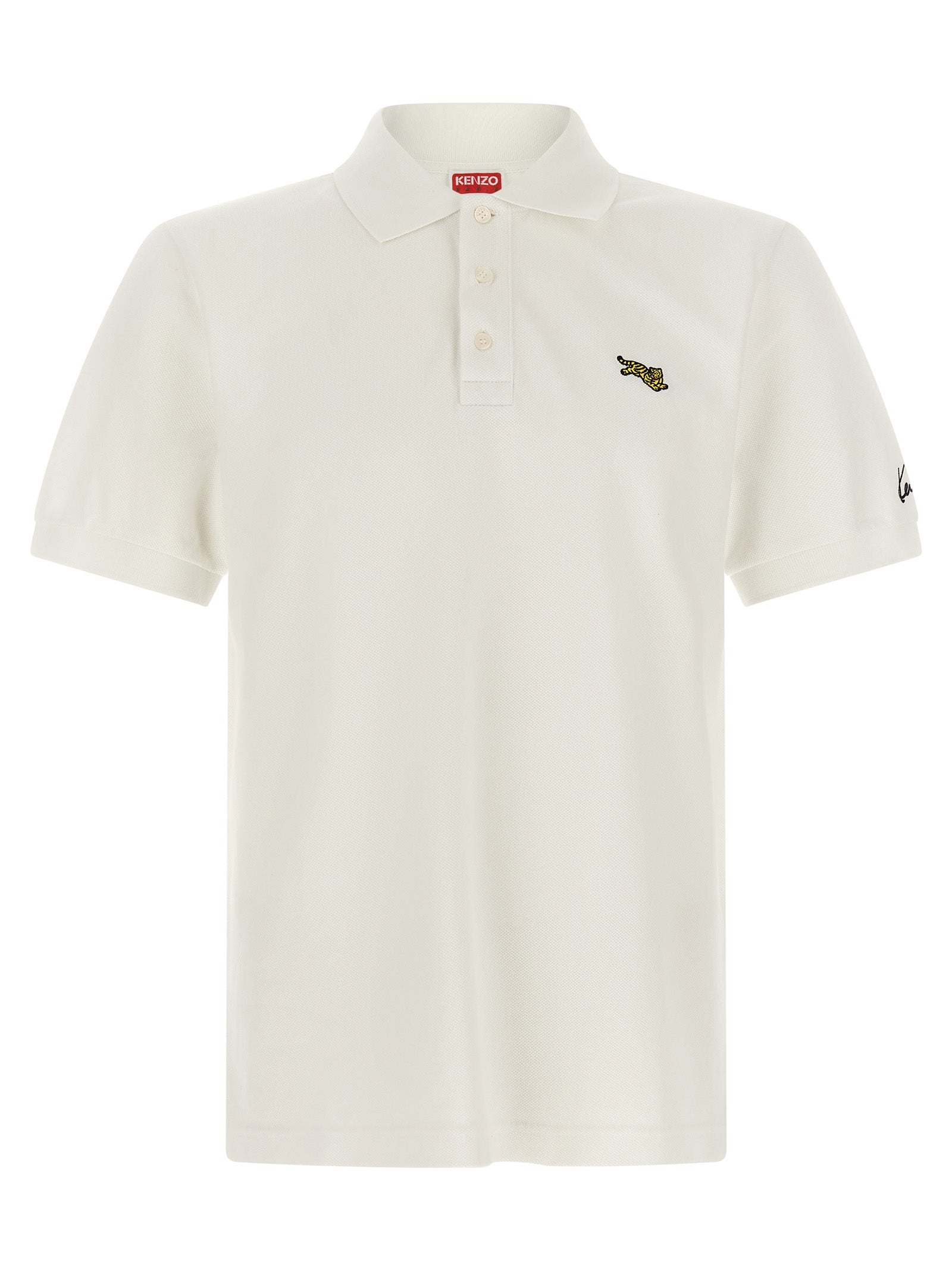 Chemise polo blanche en coton de la marque Kenzo, vue en gros plan, avec col et boutons visibles.