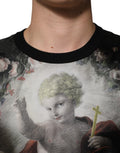 Pull Dolce & Gabbana en cachemire noir avec imprimé chérubins et motif baroque, détails élégants et confortables.