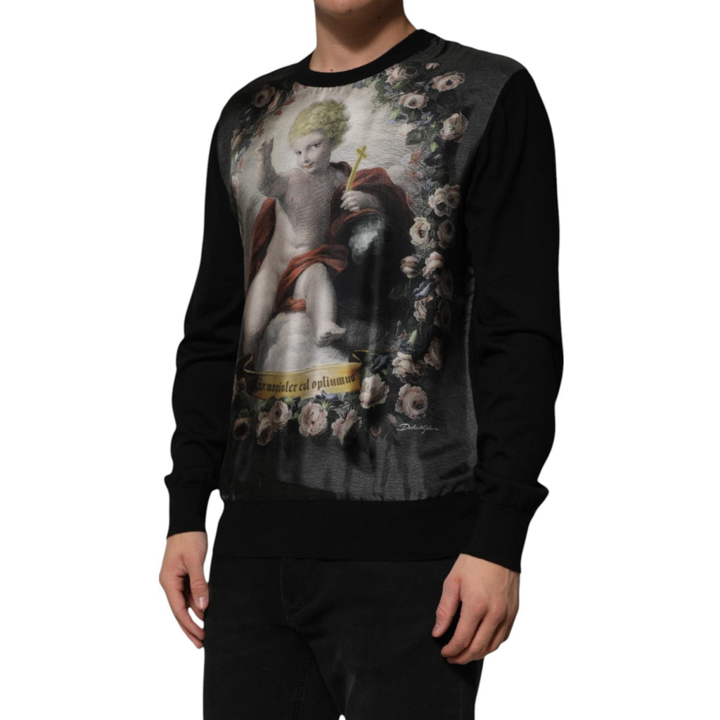 Pull Dolce & Gabbana en cachemire noir avec motif ange et broderies baroques, douceur élégante et détails sophistiqués.