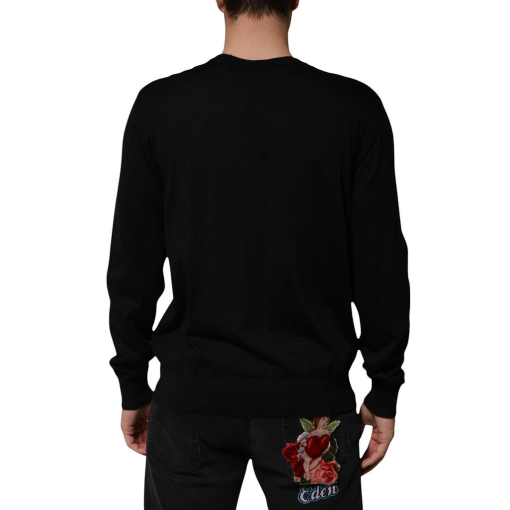 Pull en cachemire noir Dolce & Gabbana avec imprimé de chérubins et motif baroque, détail élégant et sophistiqué.