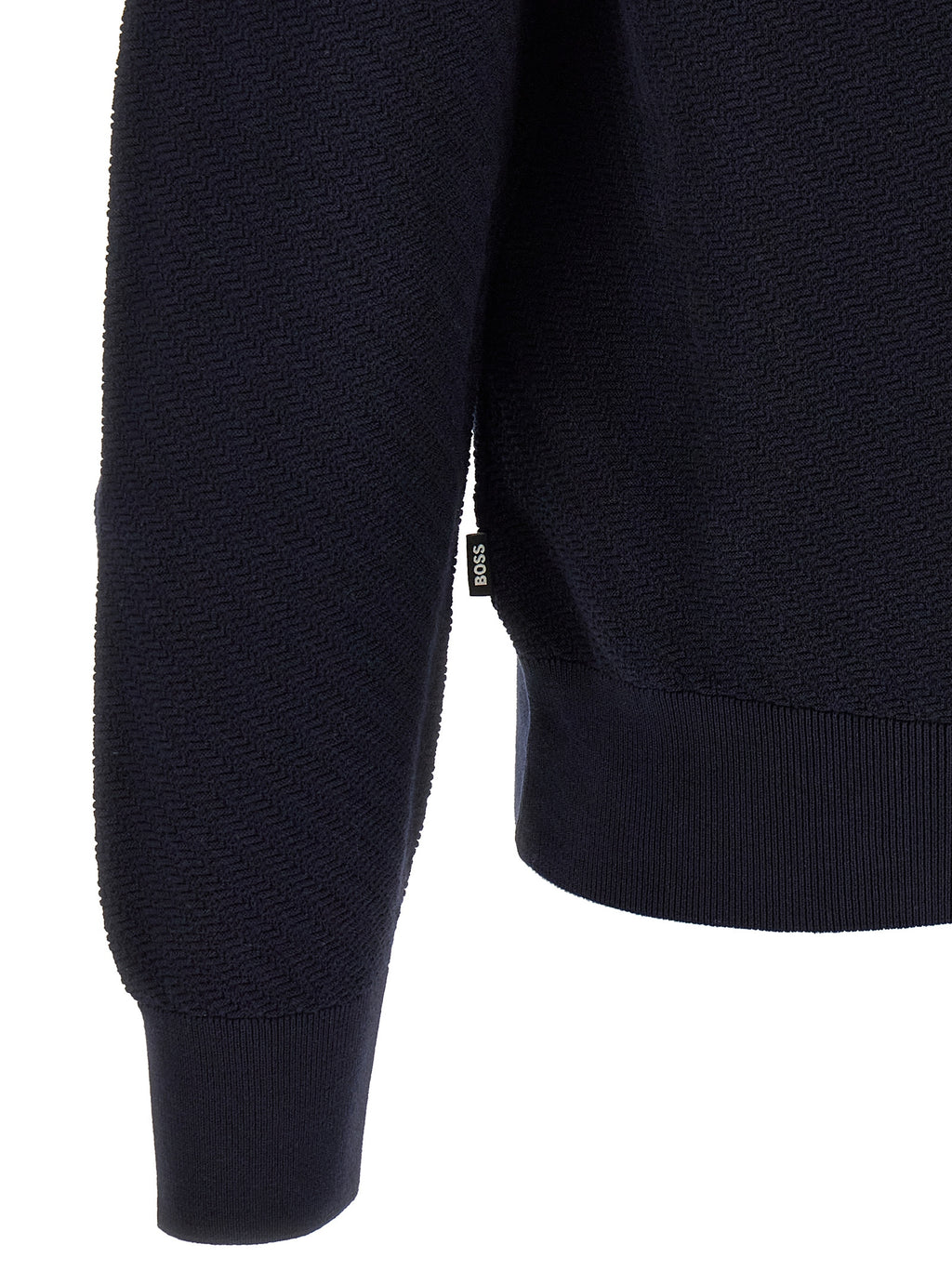 Chemise polo en coton bleu de la marque Hugo Boss, col classique et logo discret sur la poitrine.