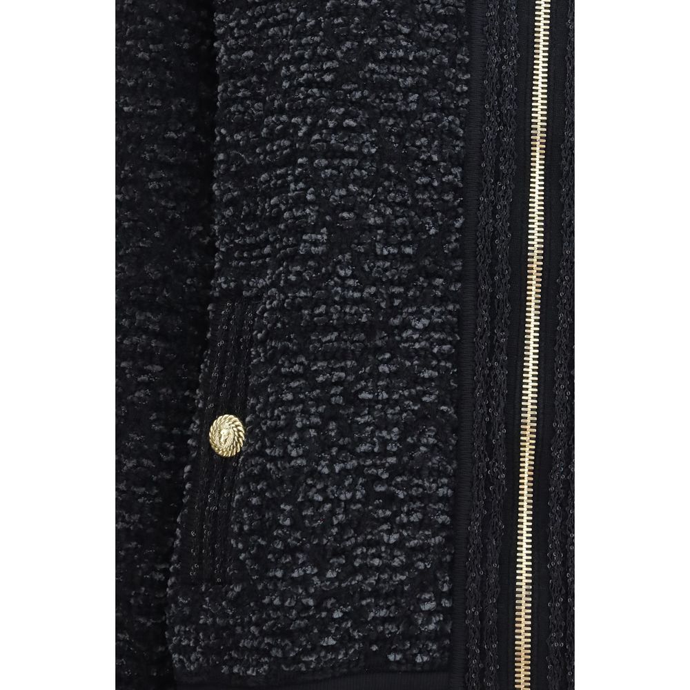 Veste bomber noire en viscose de la marque Balmain, avec détails modernes et coupe élégante.