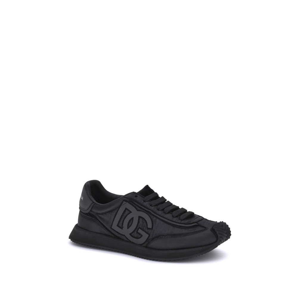 Chaussures de sport noires Dolce & Gabbana en tissu avec semelle blanche, style athlétique et moderne.