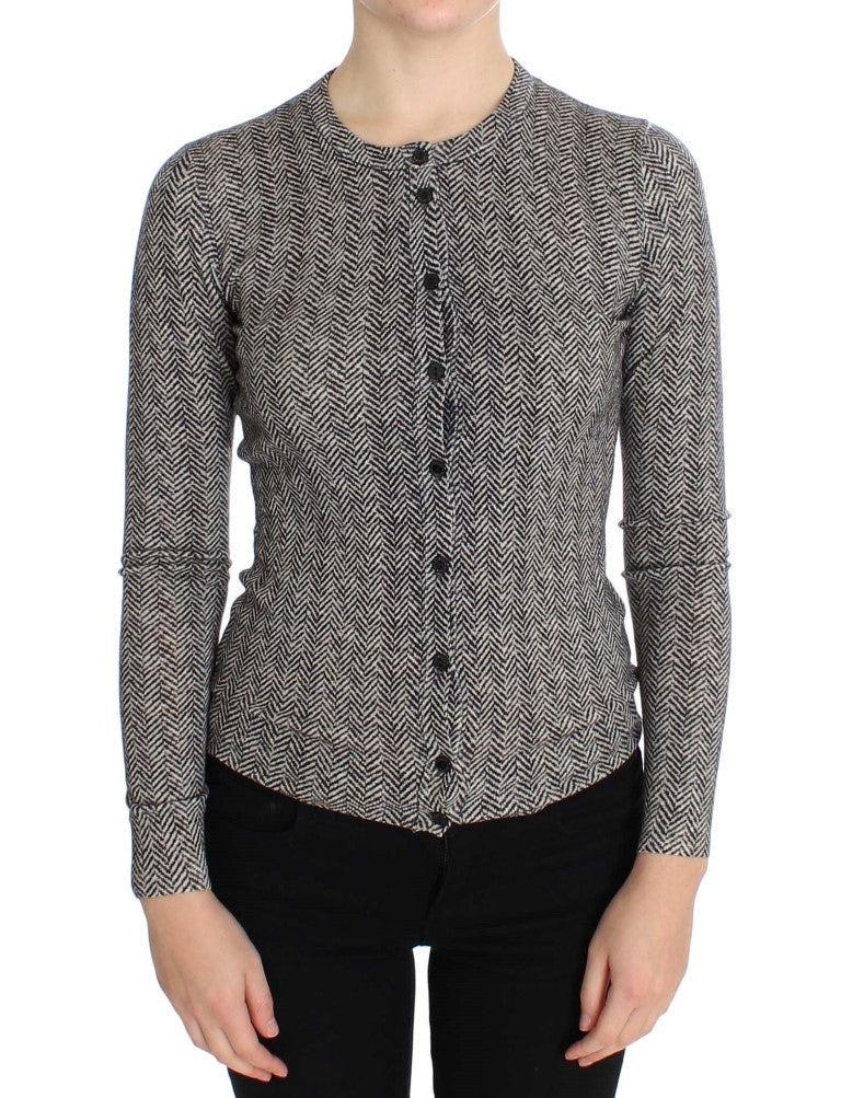Pull en laine noir et blanc Dolce & Gabbana, cardigan élégant avec détails texturés, porté ouvert sur fond neutre.