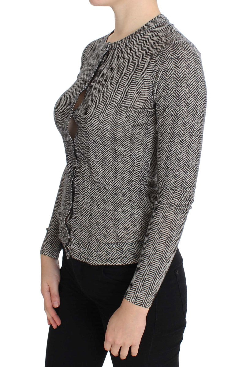 Pull en laine noir et blanc de Dolce & Gabbana, cardigan chic avec détails élégants, porté sur un mannequin.