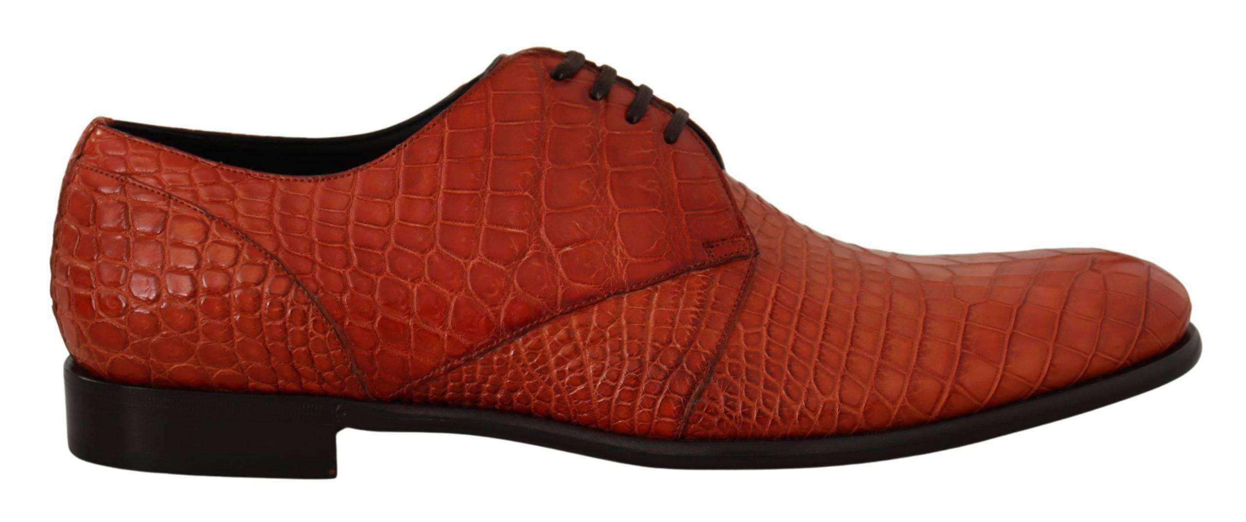Chaussures Derby en cuir exotique orange de Dolce & Gabbana, élégantes et sophistiquées, vues de face avec détails de la texture.