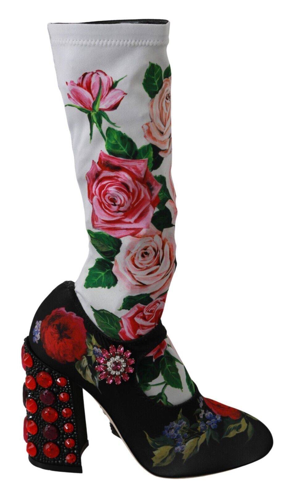 Chaussettes noires à fleurs Dolce & Gabbana avec cristaux, portées avec des bottes en jersey pour un look élégant.