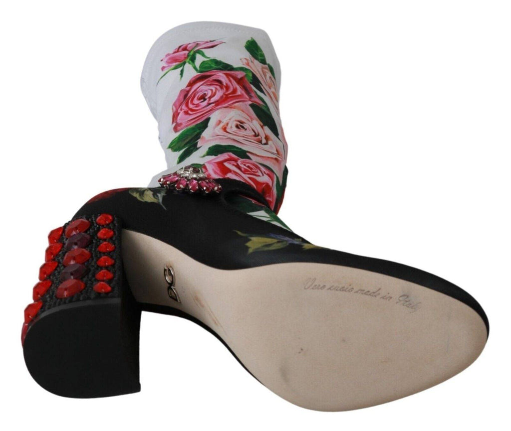 Chaussettes florales noires Dolce & Gabbana avec cristaux, associées à des bottines en jersey pour un look élégant et sophistiqué.