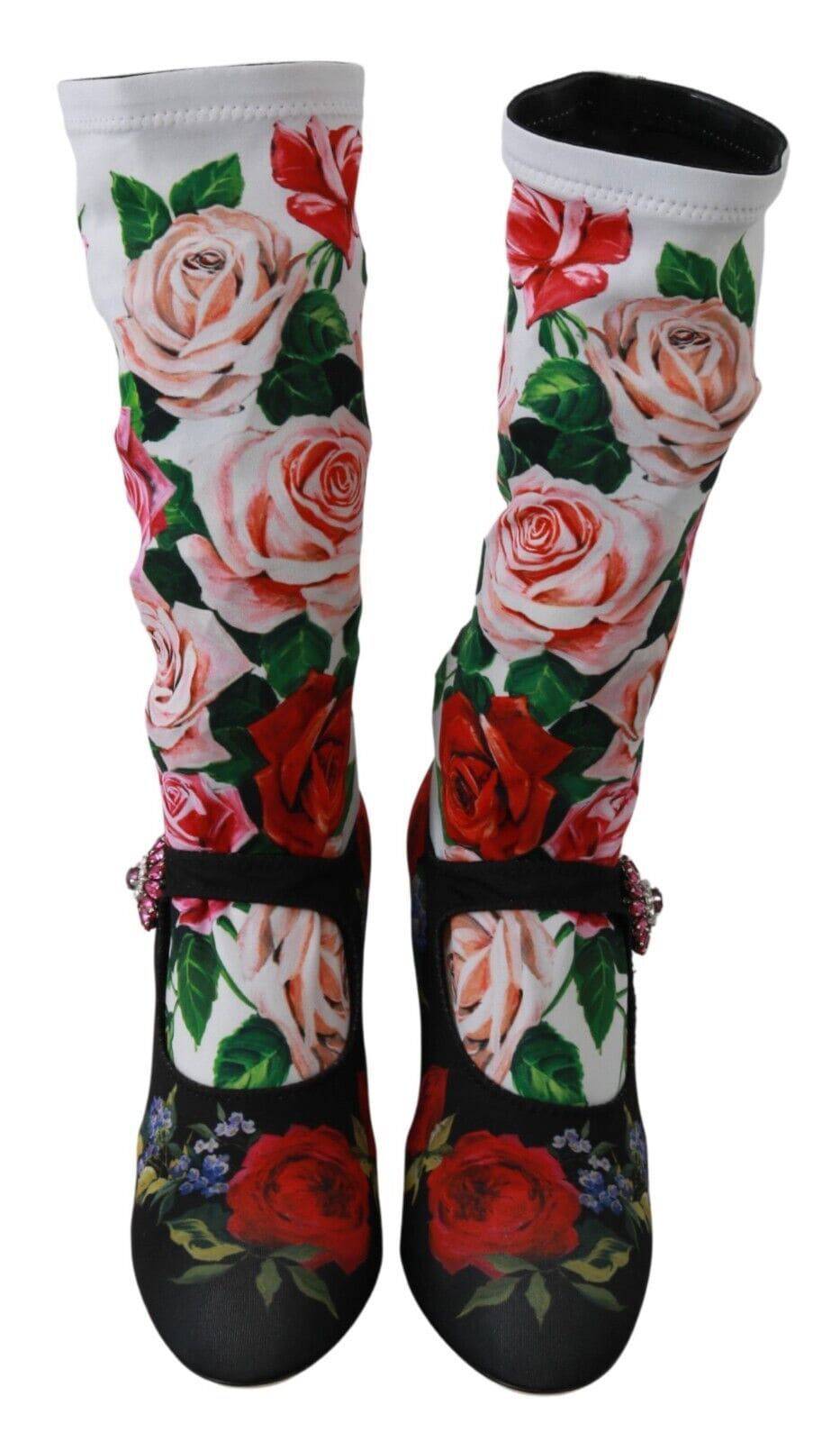 Chaussettes florales noires Dolce & Gabbana avec cristaux, portées avec des bottines en jersey brillant.