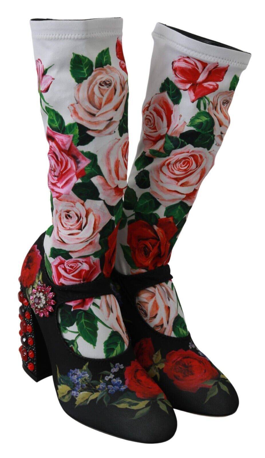 Chaussettes noires à fleurs Dolce & Gabbana avec cristaux, associées à des bottes en jersey pour un look élégant et sophistiqué.