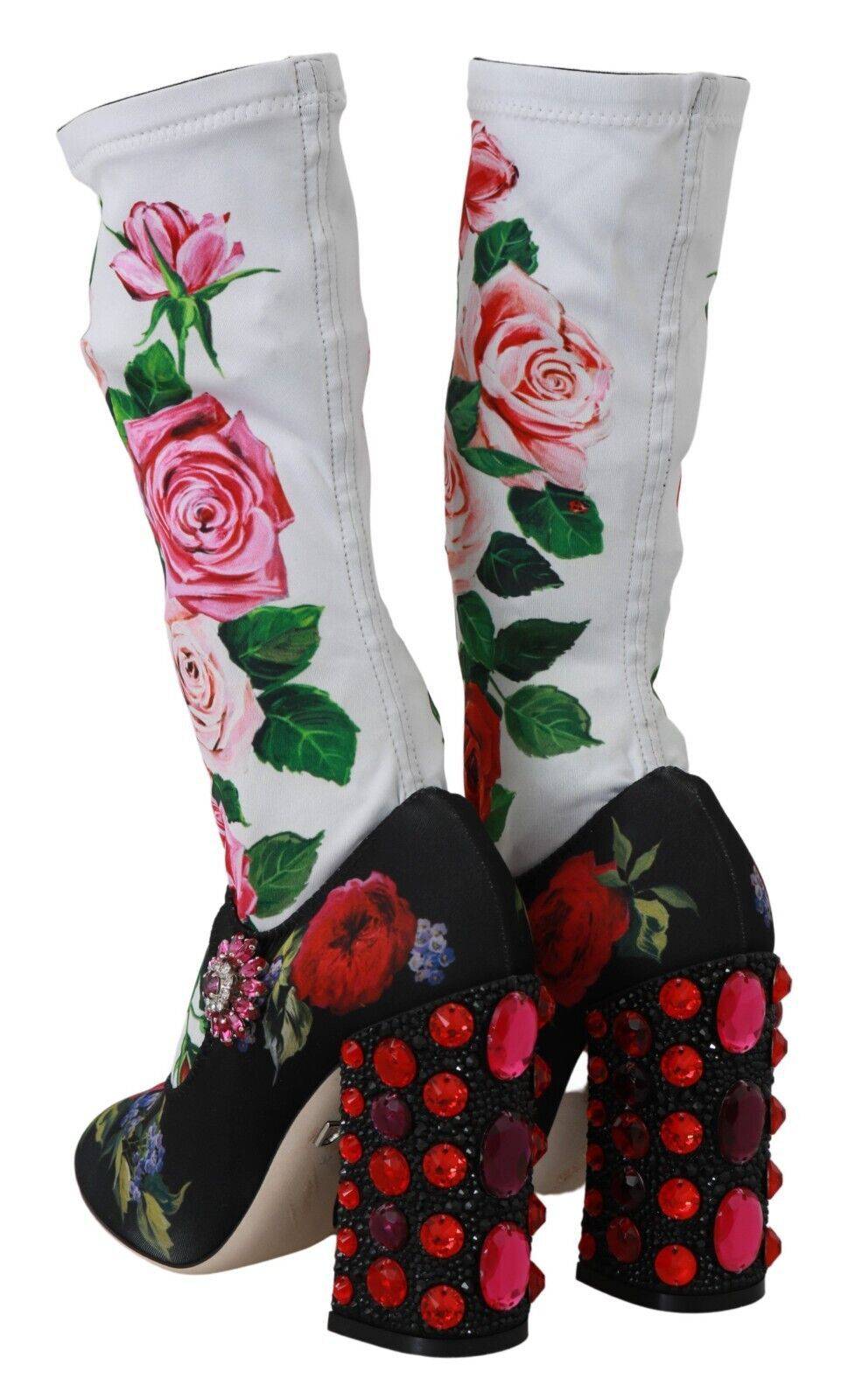 Chaussettes florales noires Dolce & Gabbana avec cristaux, portées avec des bottines en jersey pour un style élégant.