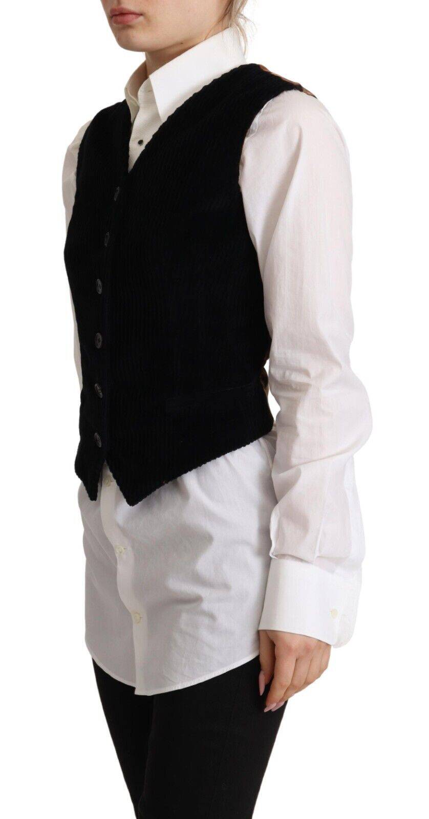 Veste sans manches en velours côtelé noir à col en V avec motif léopard de Dolce & Gabbana, boutons sur le devant.