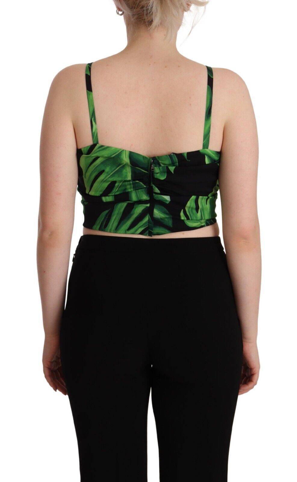 Haut court en soie noire et verte à feuilles, style halter, de la marque Dolce & Gabbana, avec détails élégants.