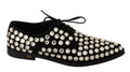 Chaussures formelles en cuir noir Dolce & Gabbana avec cristaux et lacets, élégantes et sophistiquées.