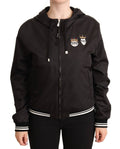 Veste bomber noire en polyester avec capuche et fermeture éclair pleine chez Dolce & Gabbana, vue de face.