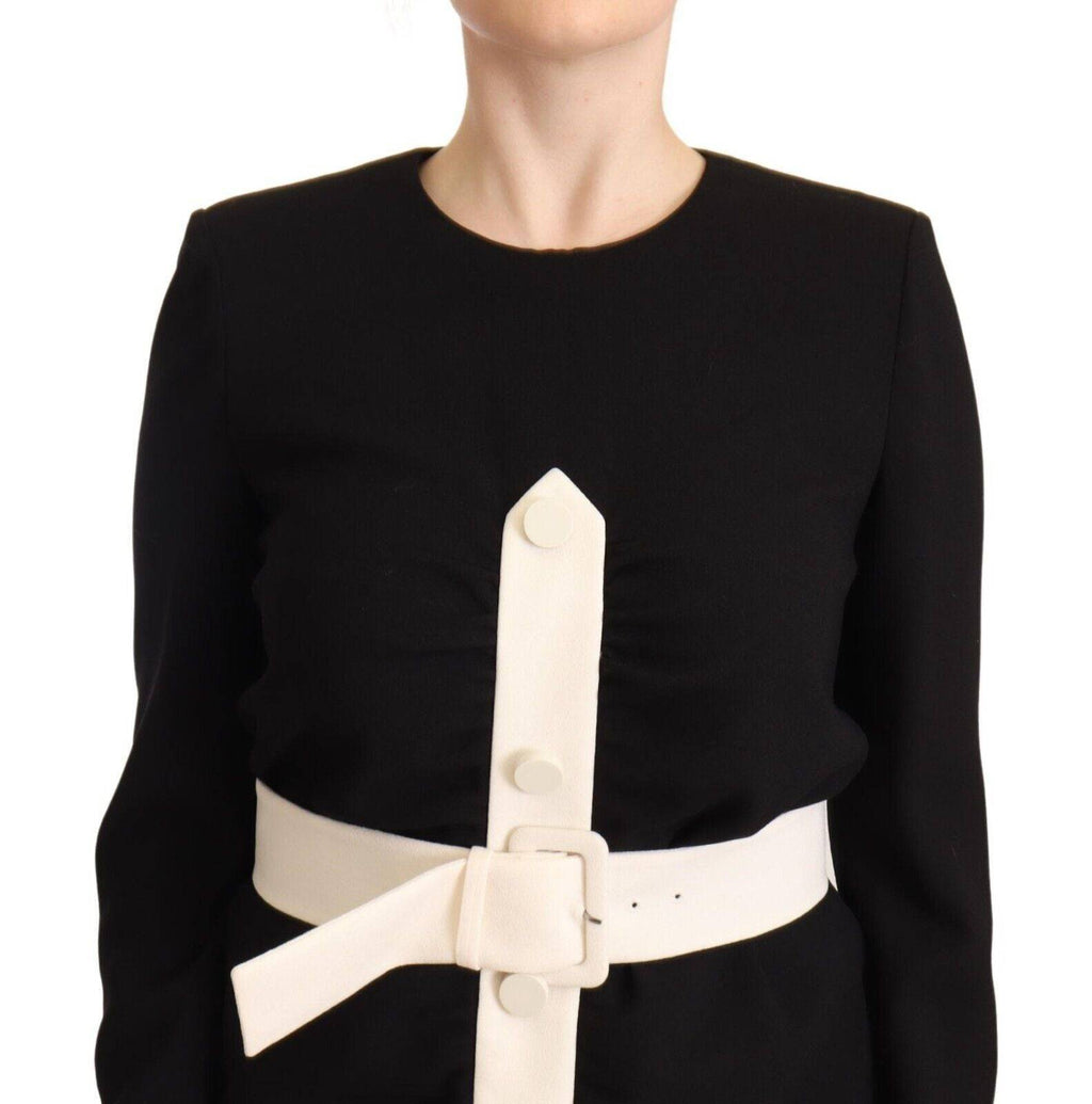 Robe courte Givenchy en laine noire avec manches longues et ceinture, ajustée et élégante, portée sur un mannequin.