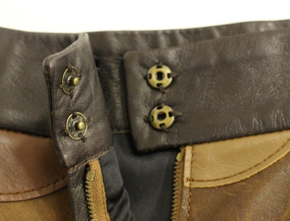 Jupe droite en cuir patchwork marron de Dolce & Gabbana, style élégant et sophistiqué, visible en détail sur l'image.