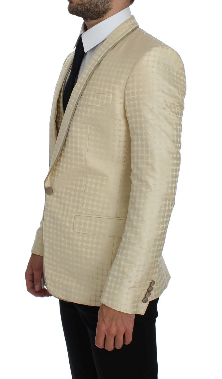 Veste en soie beige à pois Dolce & Gabbana, ensemble en deux pièces, mettant en valeur le design élégant et sophistiqué.
