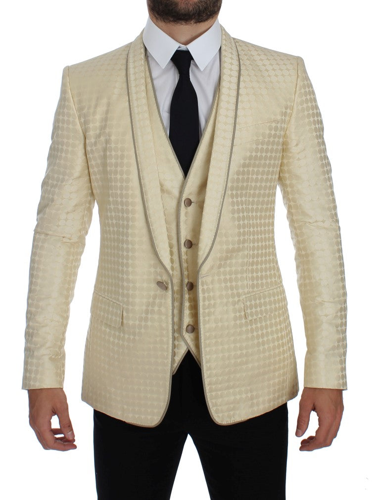 Blazer deux pièces en soie beige à pois noirs de Dolce & Gabbana, élégant et sophistiqué, vue de face.