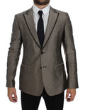 Costume en soie marron Dolce & Gabbana, blazer slim fit à deux boutons, élégant et moderne, visible sur l'image.