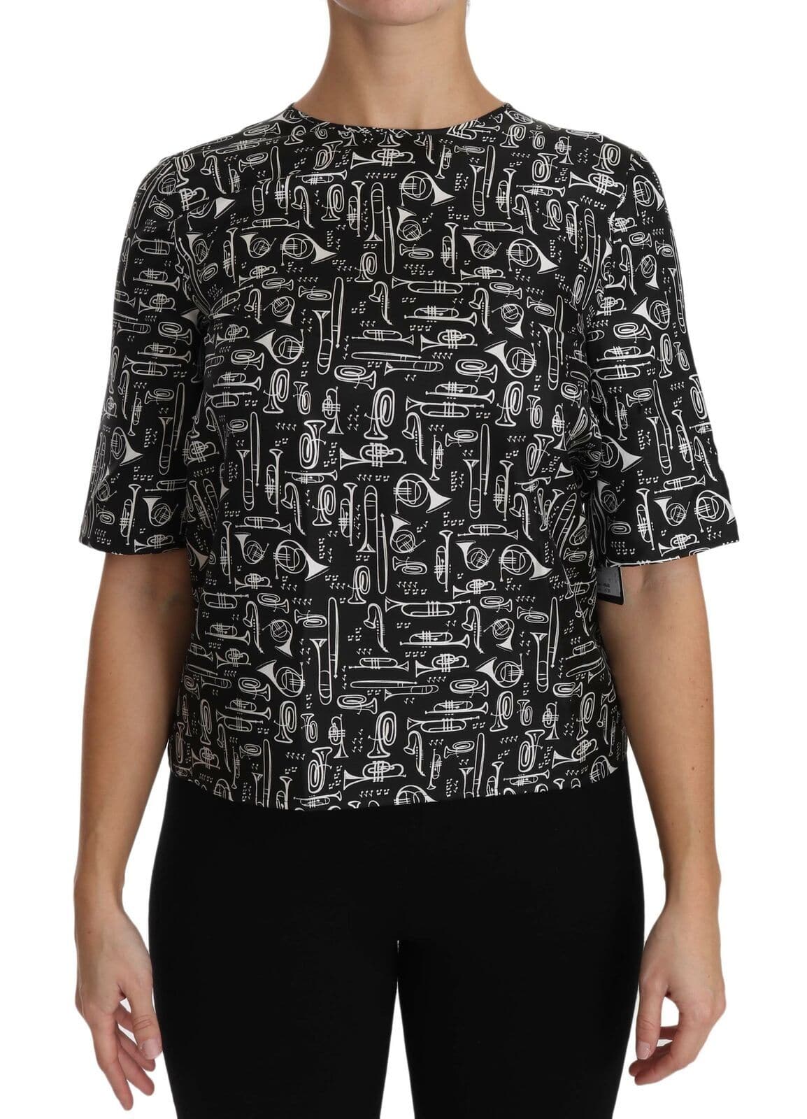 Blouse en soie noire Dolce & Gabbana avec imprimé d'instruments de musique, style élégant et sophistiqué.