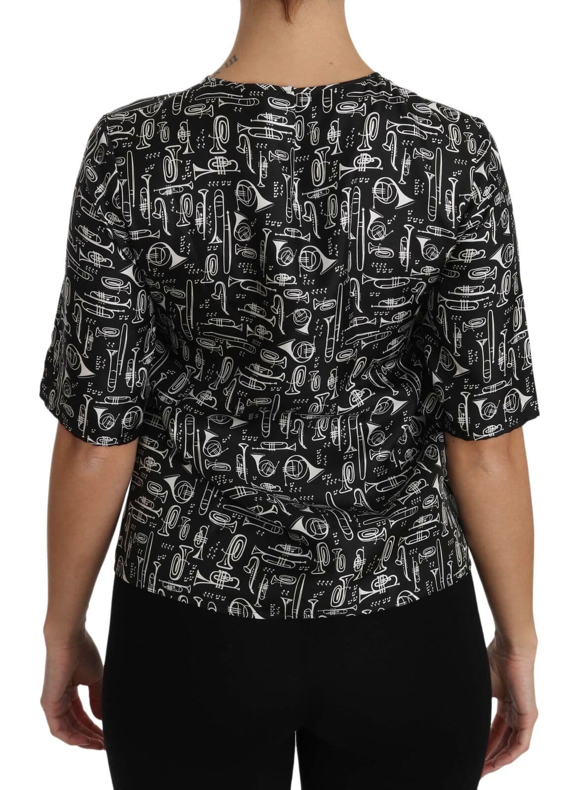 Chemisier en soie noir Dolce & Gabbana avec motif d'instruments de musique, style élégant et sophistiqué.
