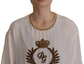 Chemise en soie blanche Dolce & Gabbana avec couronne en or et cristaux, élégante haut de blouse.