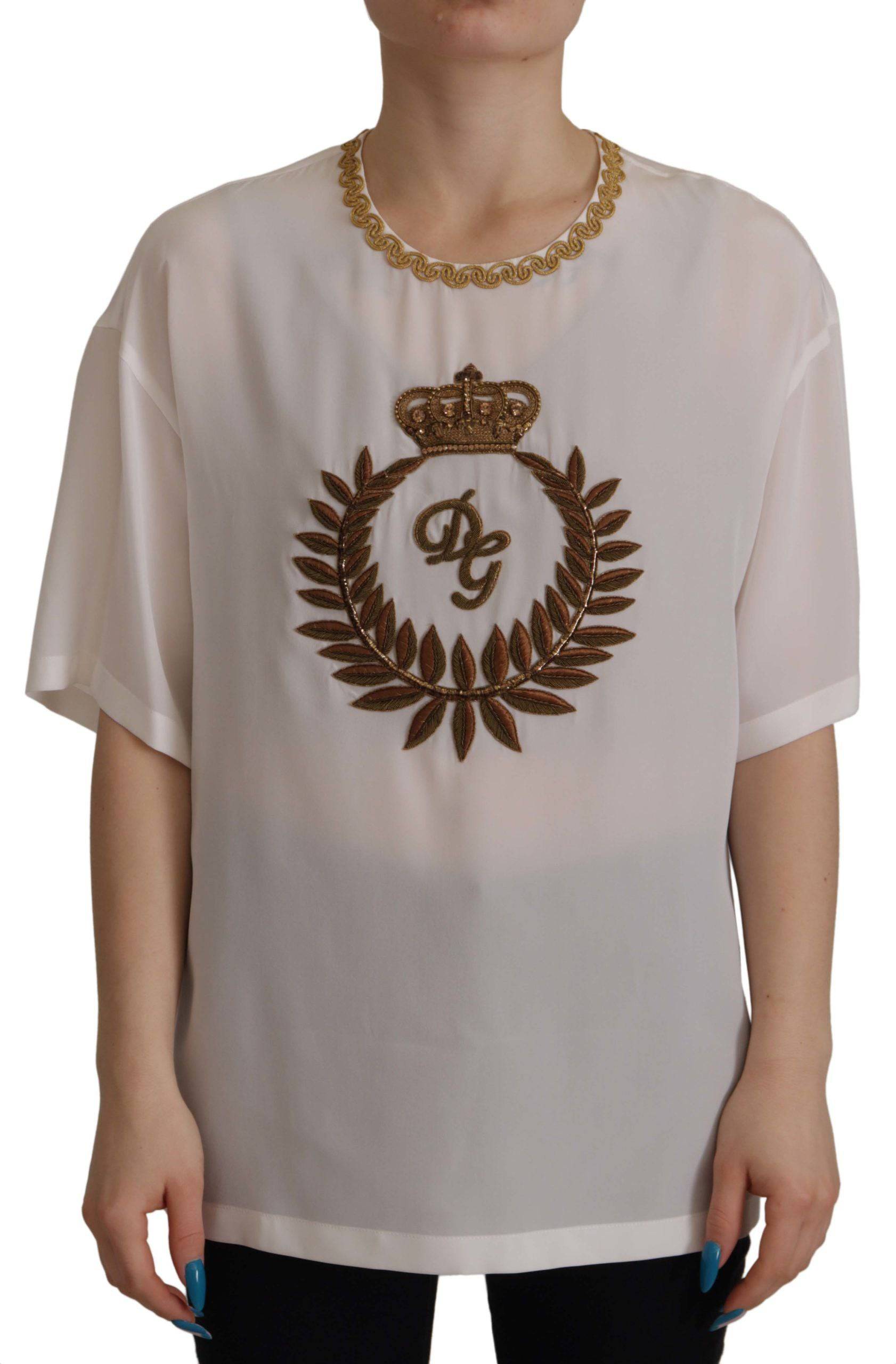 Chemisier Dolce & Gabbana en soie blanche avec ornement DG Crown en cristal, style élégant et sophistiqué.