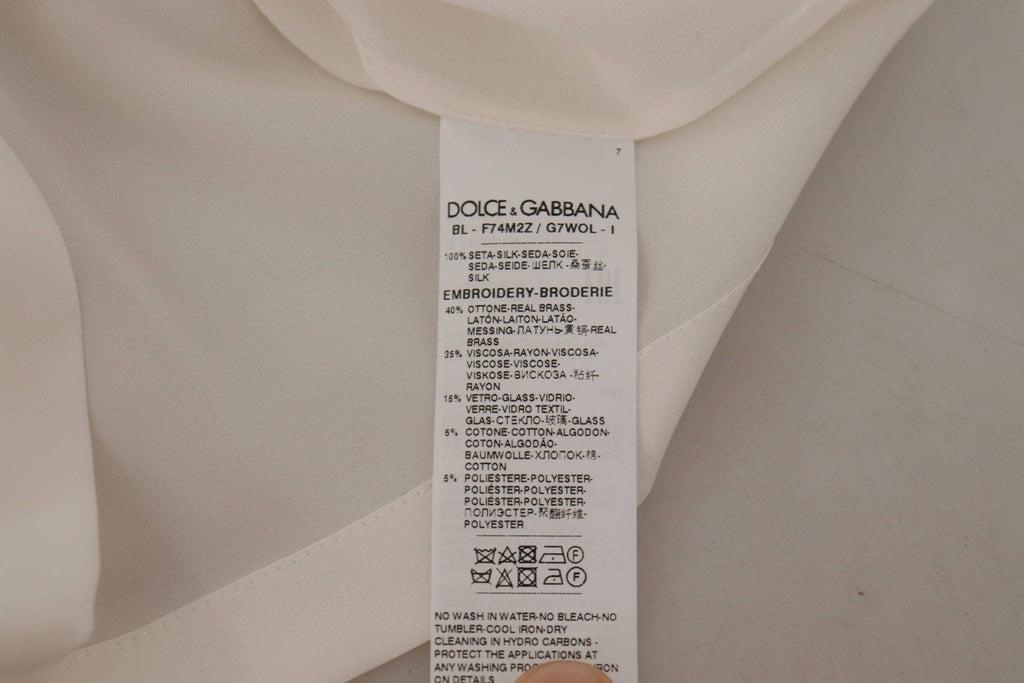Chemise en soie blanche Dolce & Gabbana avec ornement DG, couronne en cristal, élégante blouse raffinée pour femmes.