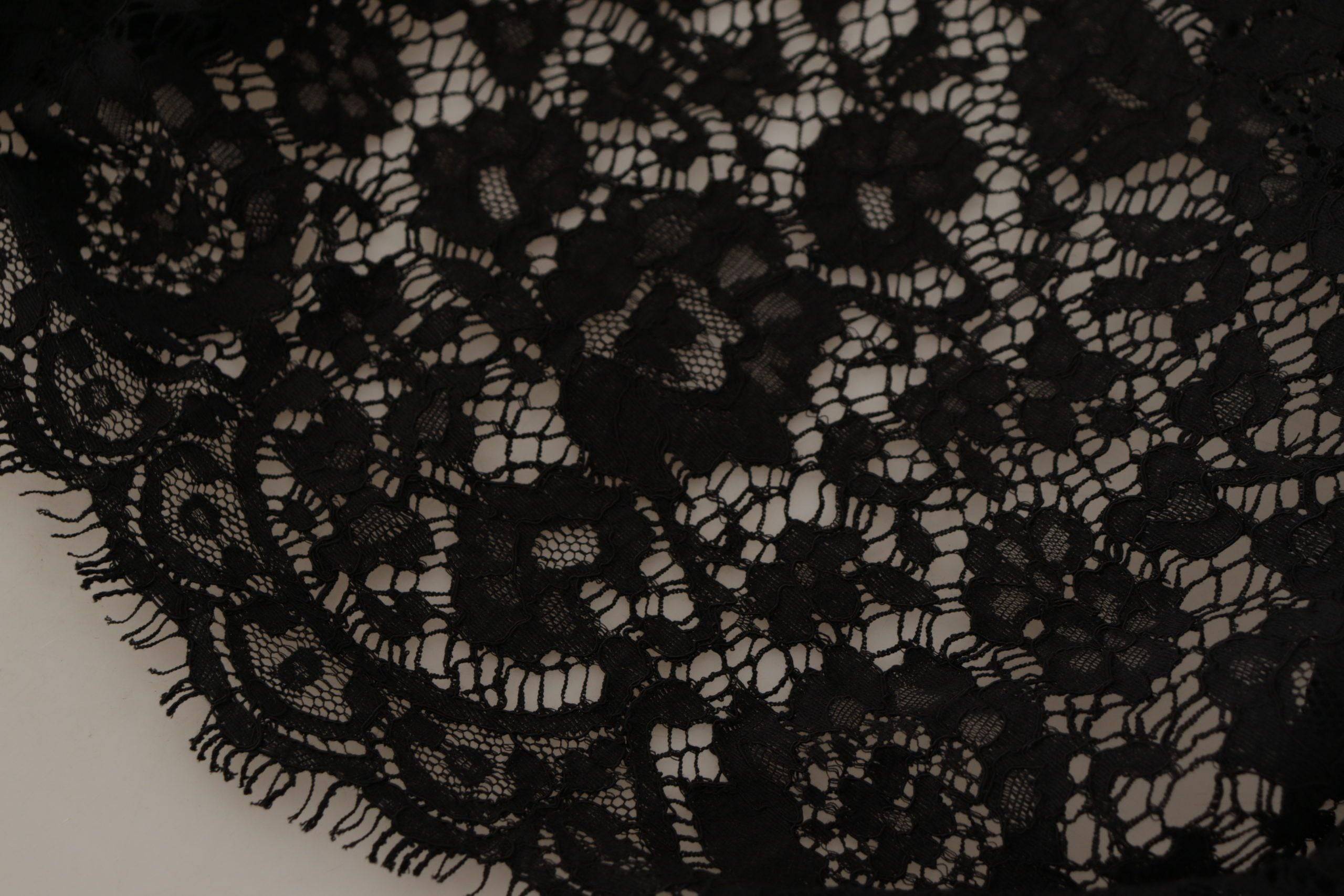 Pull Dolce & Gabbana en dentelle florale noire, style blouse Sicily, avec détails délicats et finition élégante.