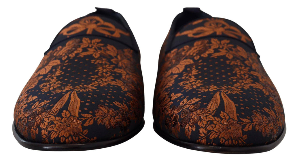 Chaussures Dolce & Gabbana en velours bleu avec motif floral rust, slippers ou loafers élégants pour femme.