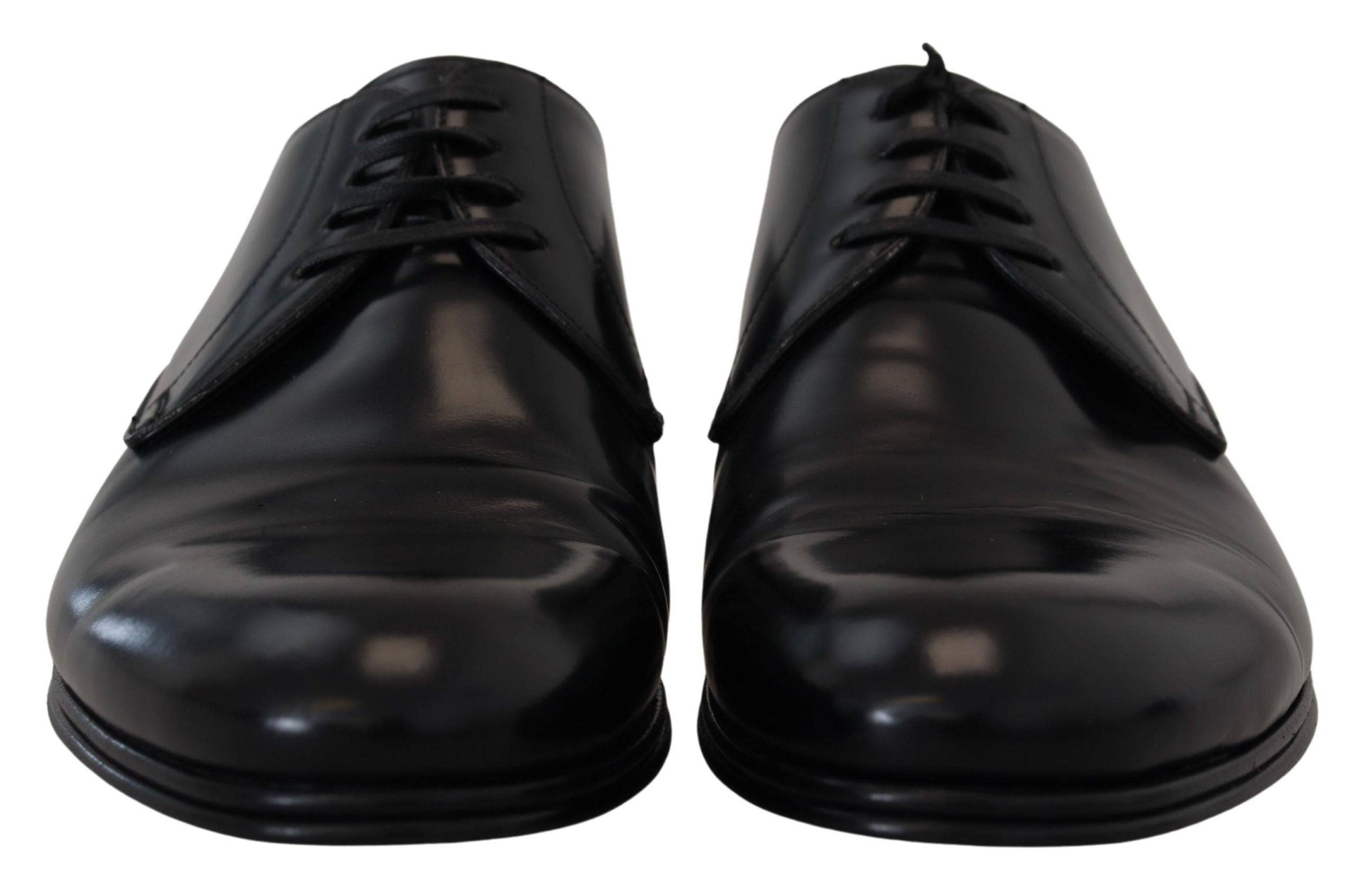 Chaussures de costume en cuir noir Dolce & Gabbana pour hommes, élégantes et sophistiquées, vues de face sur fond neutre.