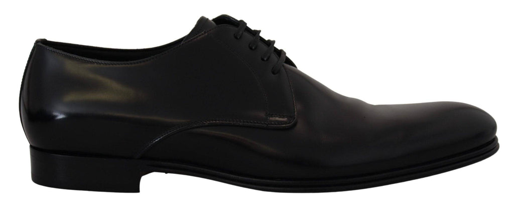 Chaussures habillées en cuir noir Dolce & Gabbana pour homme, élégantes, avec finition soignée et semelle en cuir.
