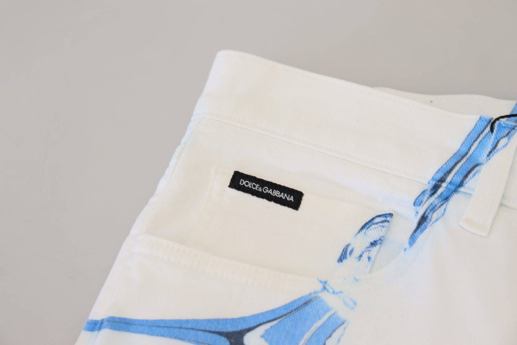 Jeans en denim blanc et bleu Dolce & Gabbana, coupe skinny, en coton extensible, visibles sur l'image.