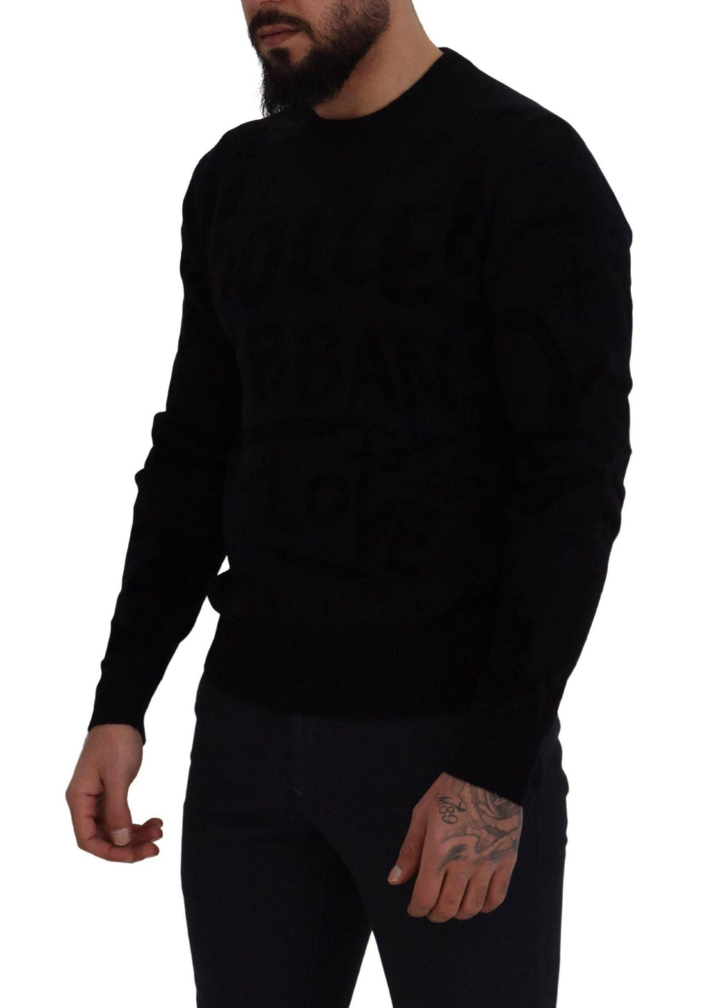 Pull en laine noire Dolce & Gabbana avec motif logo, col rond et style décontracté visible sur l'image.