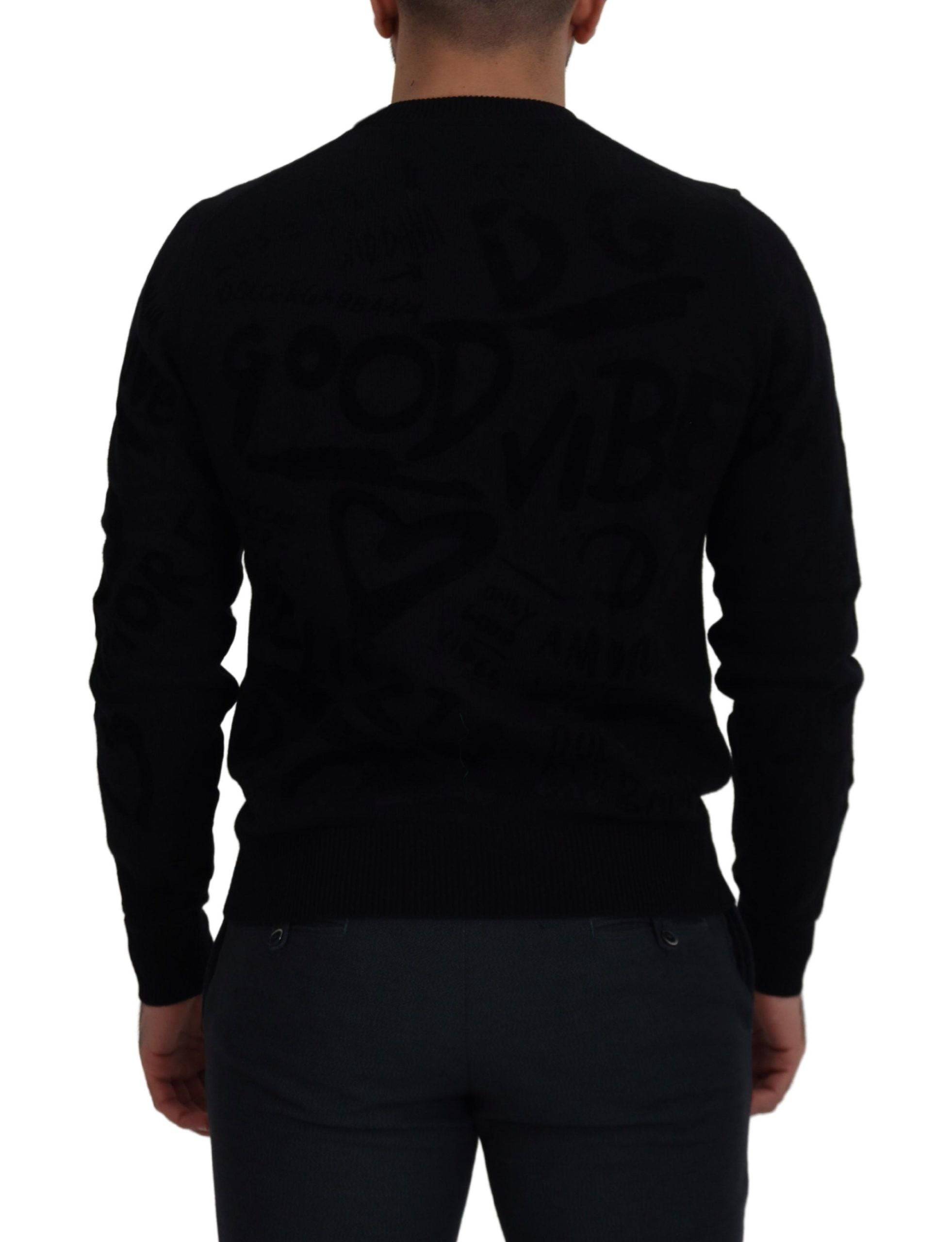 Pull-over noir en laine Dolce & Gabbana avec motif logo, col rond et design élégant visible sur l'image.