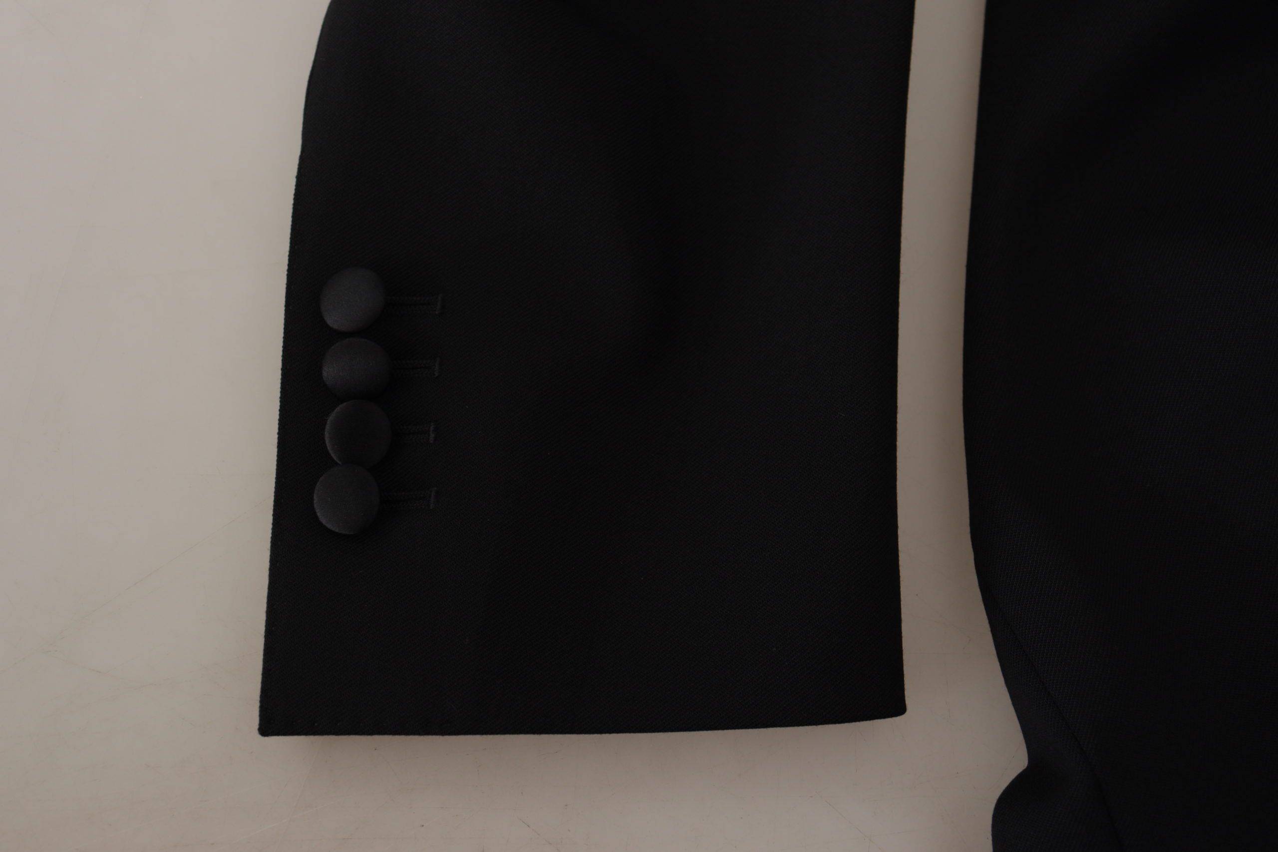 Veste blazer noire Dolce & Gabbana à double boutonnage, coupe élégante et classique, vue de face sur un fond neutre.