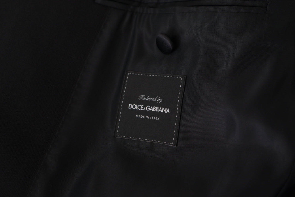 Veste blazer Dolce & Gabbana noire à double boutonnage, style élégant avec col cranté et poches latérales.