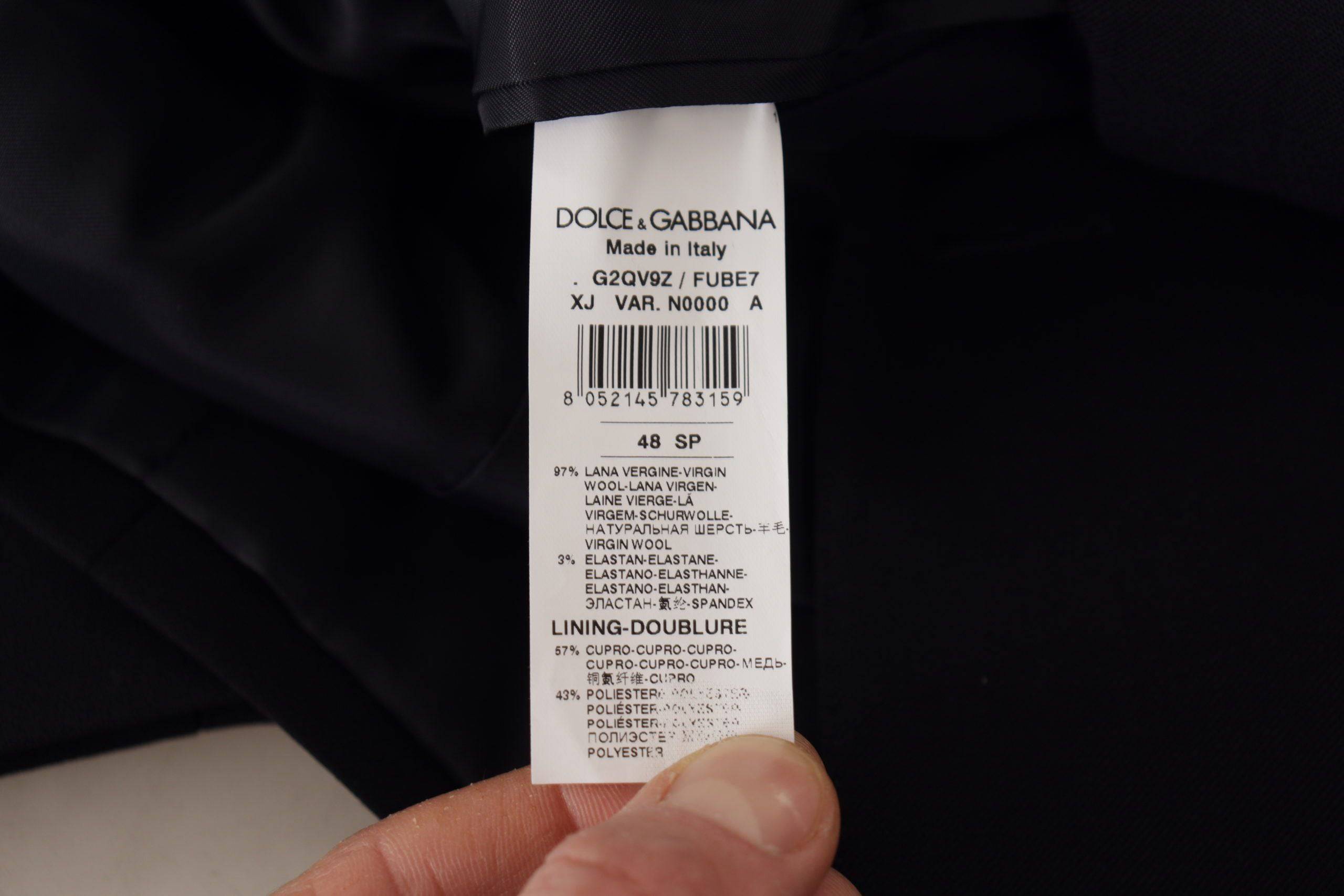Veste blazer noire à double boutonnage Dolce & Gabbana, élégant manteau pour femme avec coupe sophistiquée et détails raffinés.