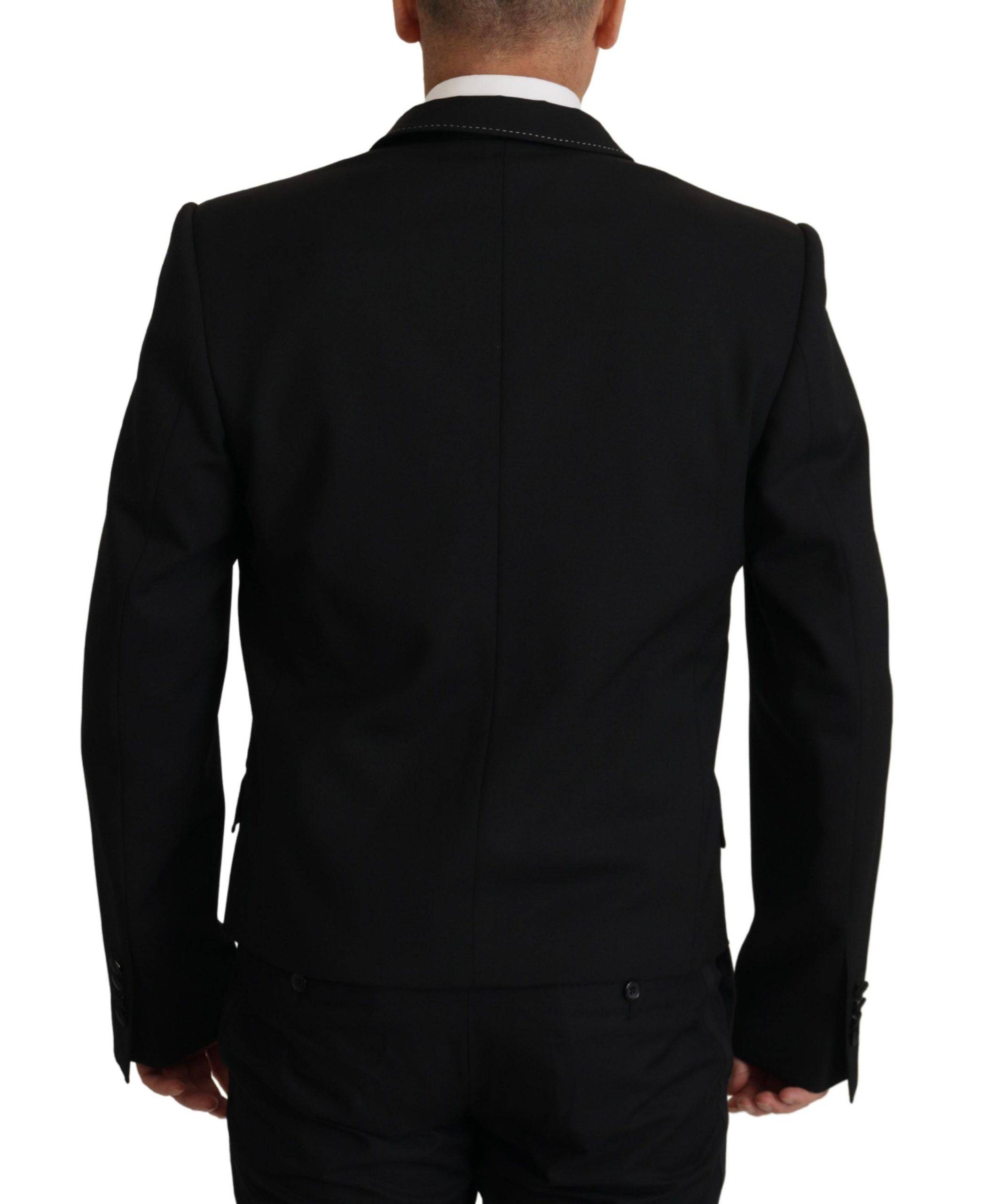 Blazer noir Dolce & Gabbana à double boutonnage, style élégant avec col cranté et boutons en métal.