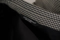 Veste blazer à carreaux gris Dolce & Gabbana, coupe simple boutonnage, tissu élégant, vue de face sur fond neutre.