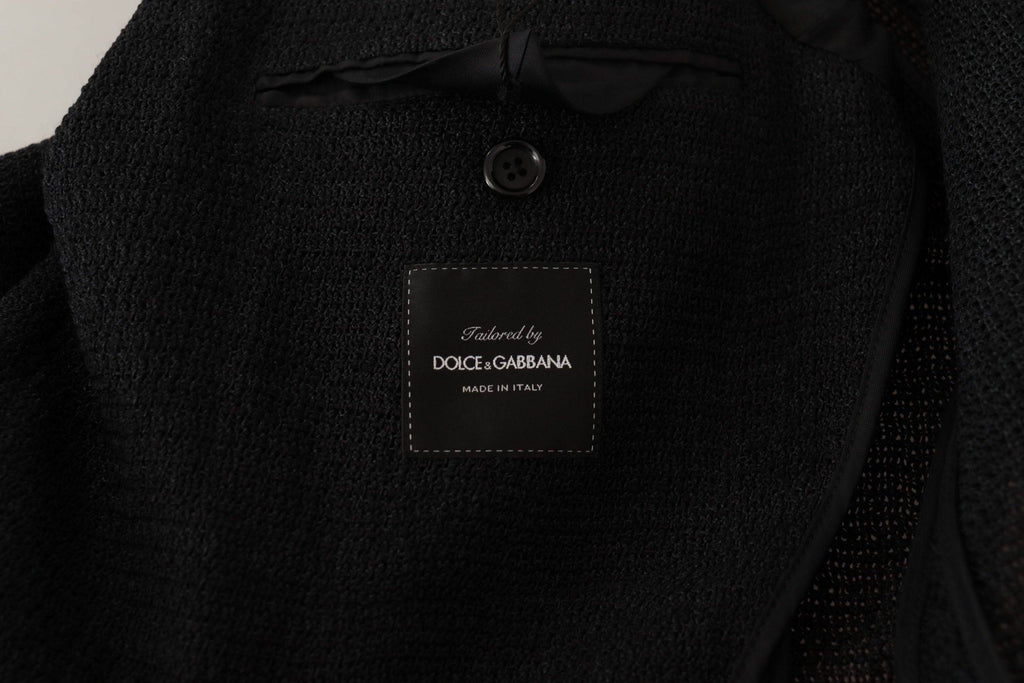 Manteau pour homme Dolce & Gabbana noir à double boutonnage, blazer élégant en tissu chic, porté sur un mannequin.