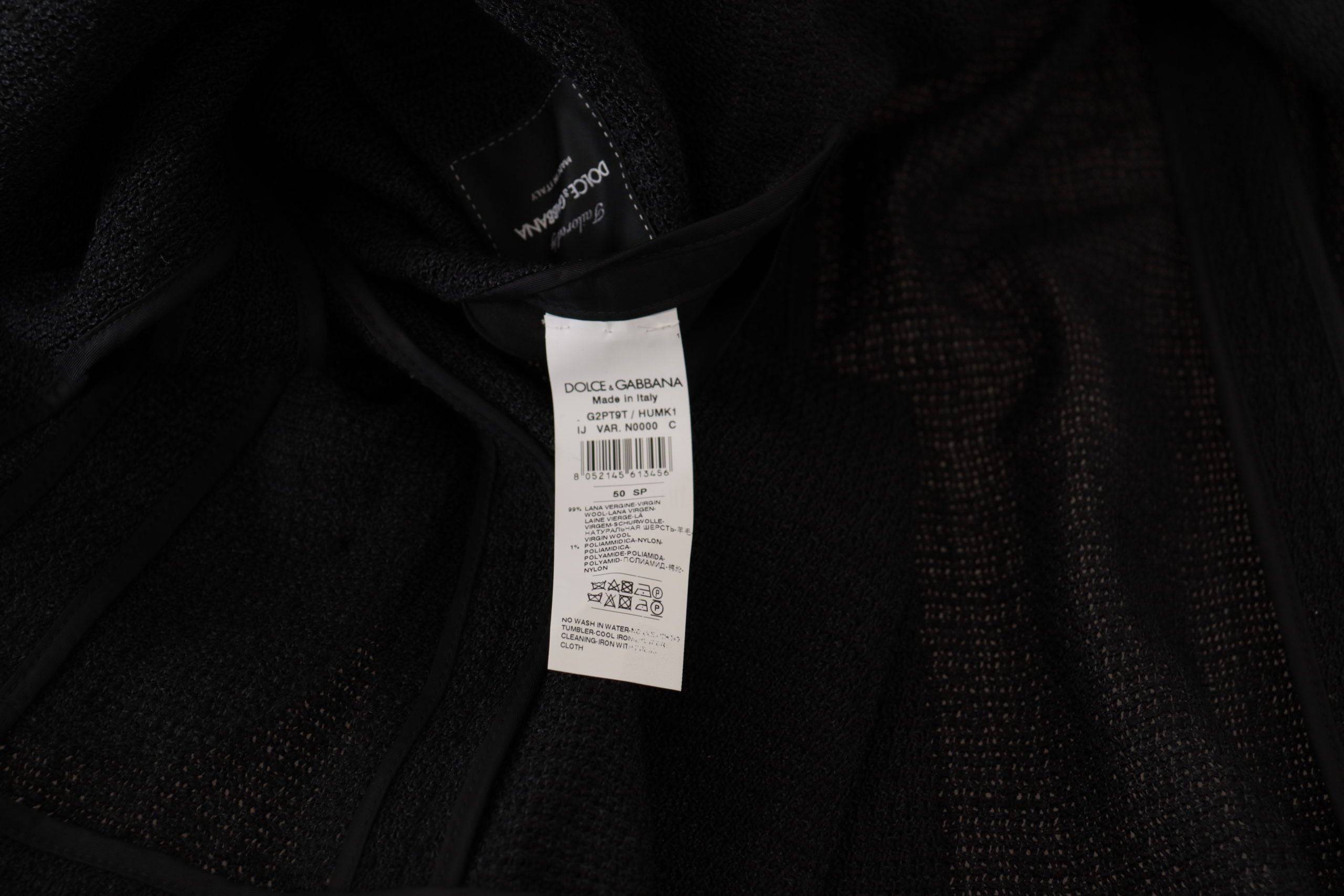 Manteau noir à un seul boutonnage de la marque Dolce & Gabbana, blazer pour homme, vue de face sur un fond blanc.