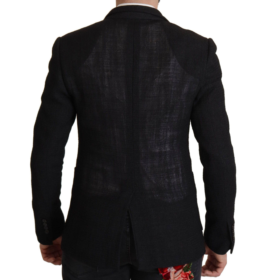 Manteau noir Dolce & Gabbana pour homme, blazer à un seul bouton, coupe élégante, en tissu de qualité, visible en détail.