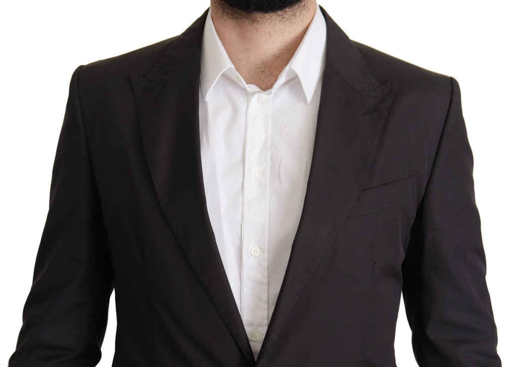 Veste blazer noire à un seul bouton Dolce & Gabbana Taormina, coupe élégante et moderne, visible en détail sur l'image.