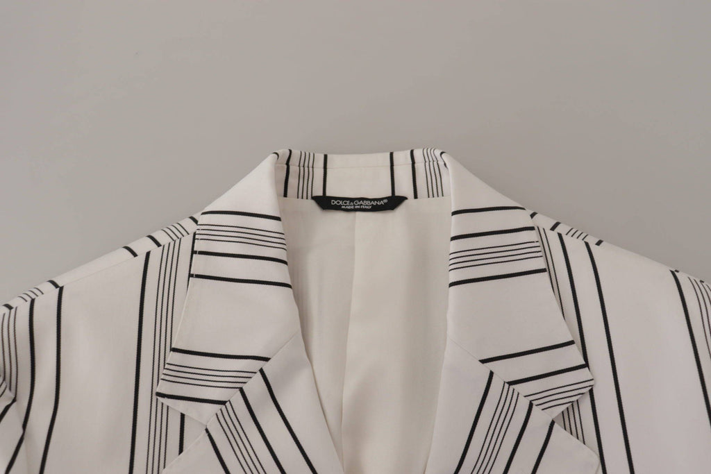 Veste blazer en coton blanc à rayures Dolce & Gabbana, coupe simple et boutonnée sur le devant, détails élégants.