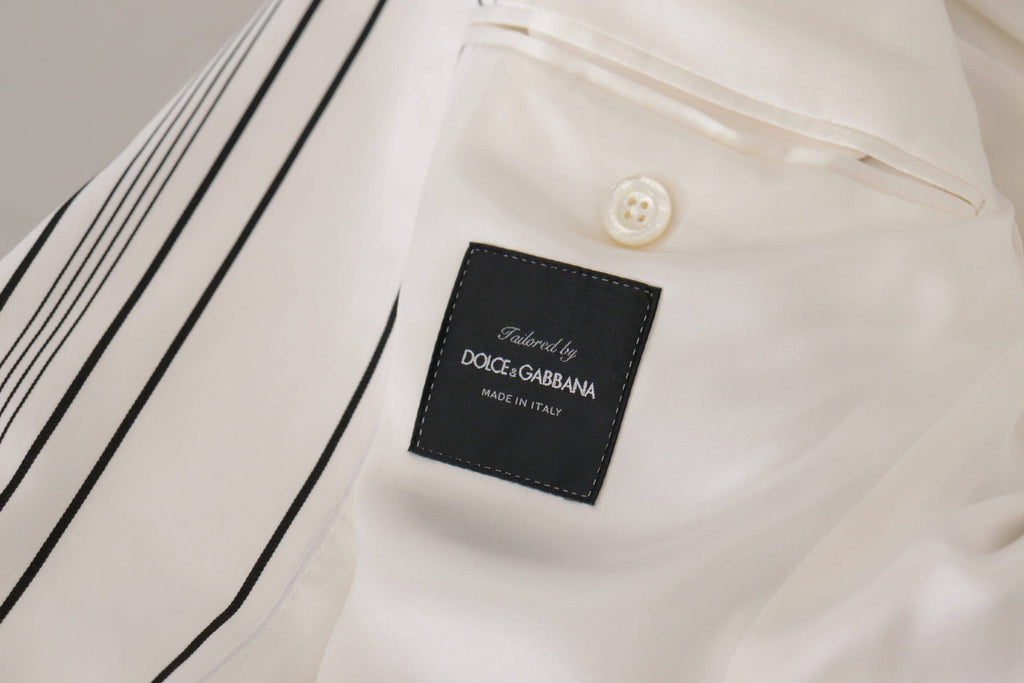 Blazer blanc à rayures en coton Dolce & Gabbana, classique et élégant, à coupe croisée simple, posé sur un mannequin.