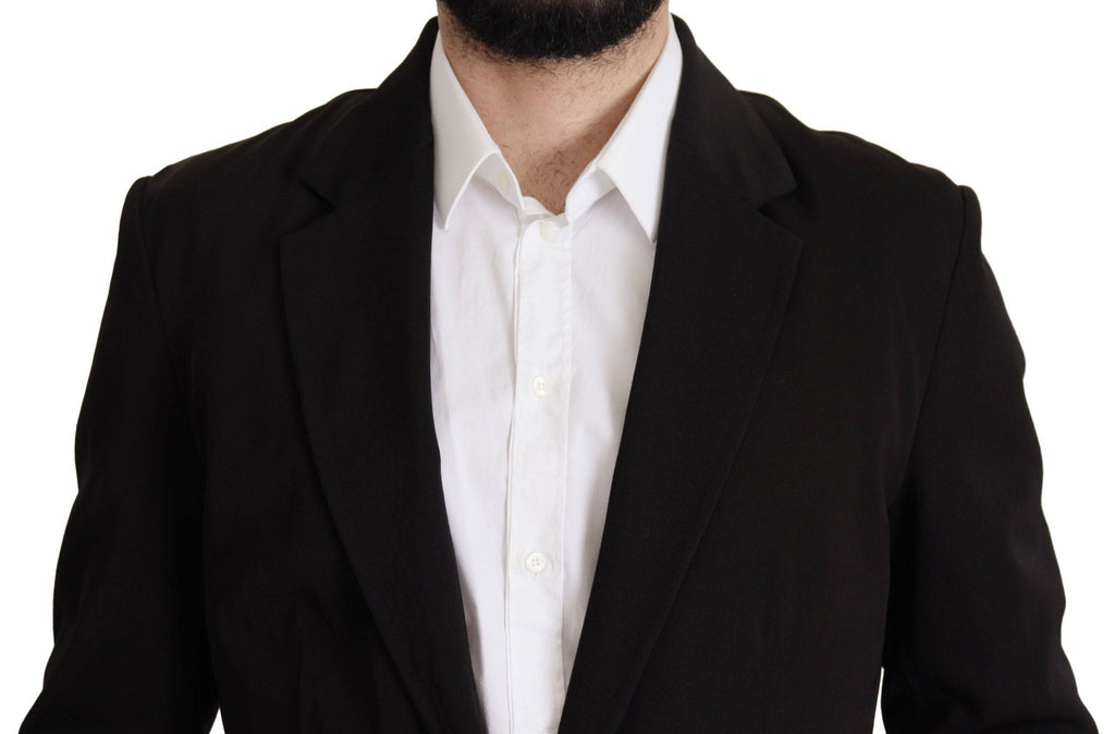 Manteau blazer noir en laine à un seul boutonnage de Dolce & Gabbana, coupe élégante et classique, porté sur un modèle.